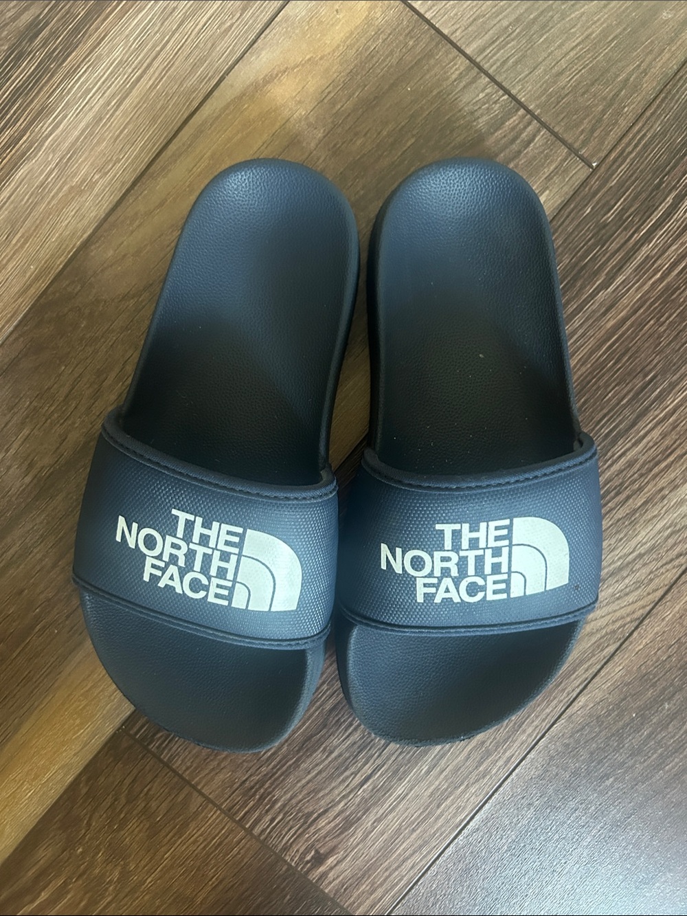 The Northface kids navy blue slides size 2 worn once - great condition